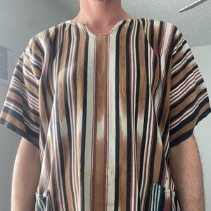 Mint condition cotton pull over, two pockets and fringe on the bottom. Large